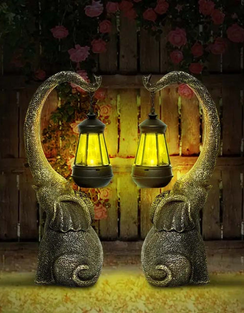 Load image into Gallery viewer, Solar Powered Elephant Statue - Color-Changing LED Garden Decor
